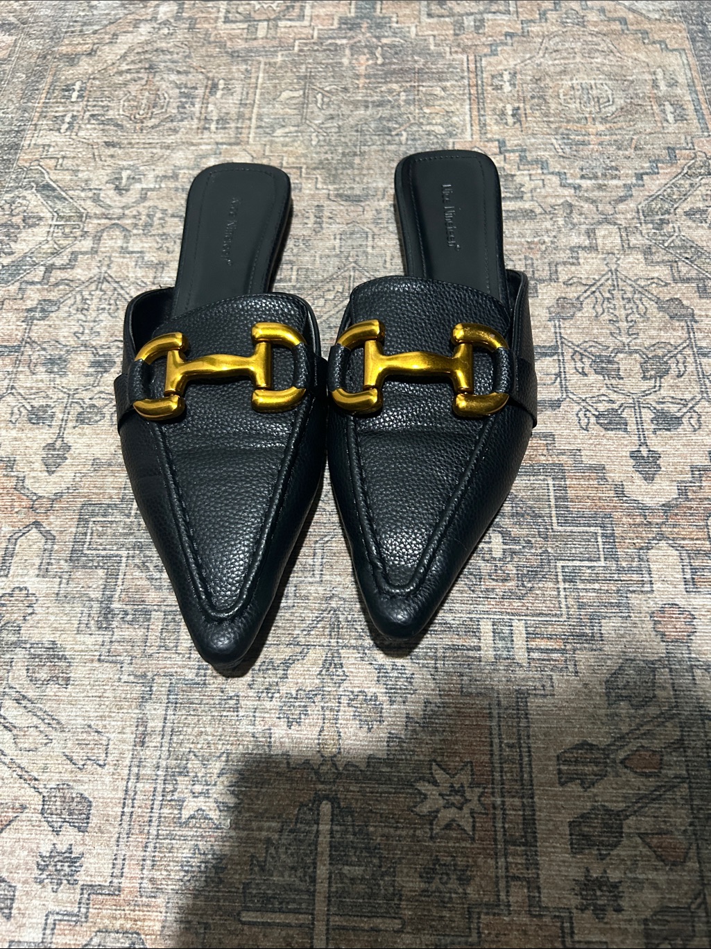 Black Pointed Leather Slip-On Mules With Gold Buckle